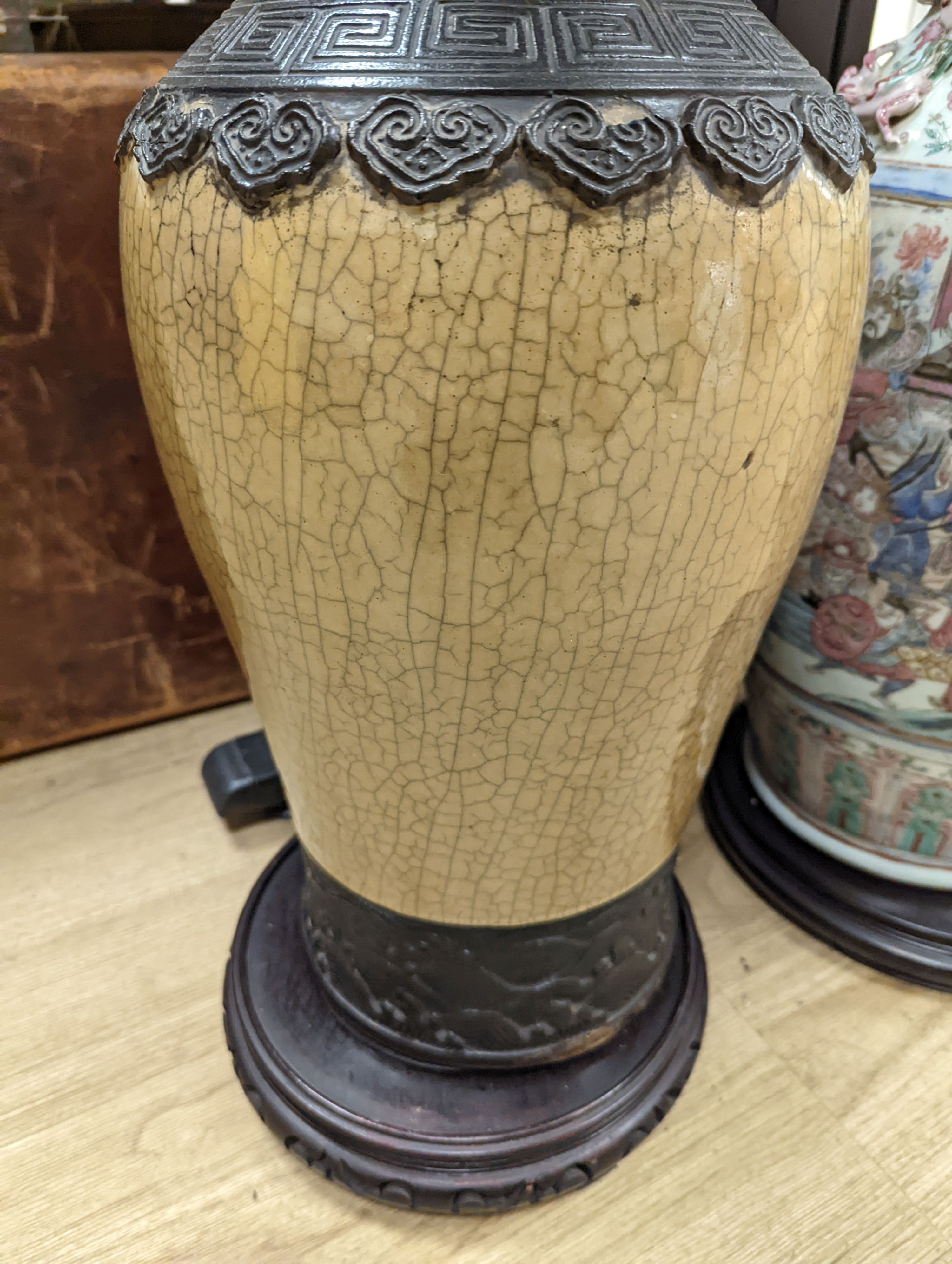 A large Chinese crackle glaze vase, late 19th/early 20th century and a large Chinese famille rose vase, late 19th century, tallest 60 cm.